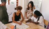 How accurate is AI translation? Group of workers checking a document.