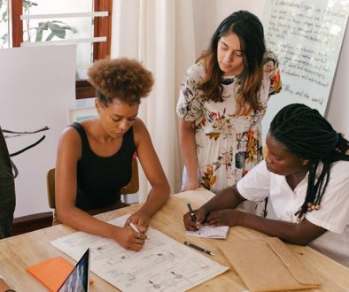 How accurate is AI translation? Group of workers checking a document.