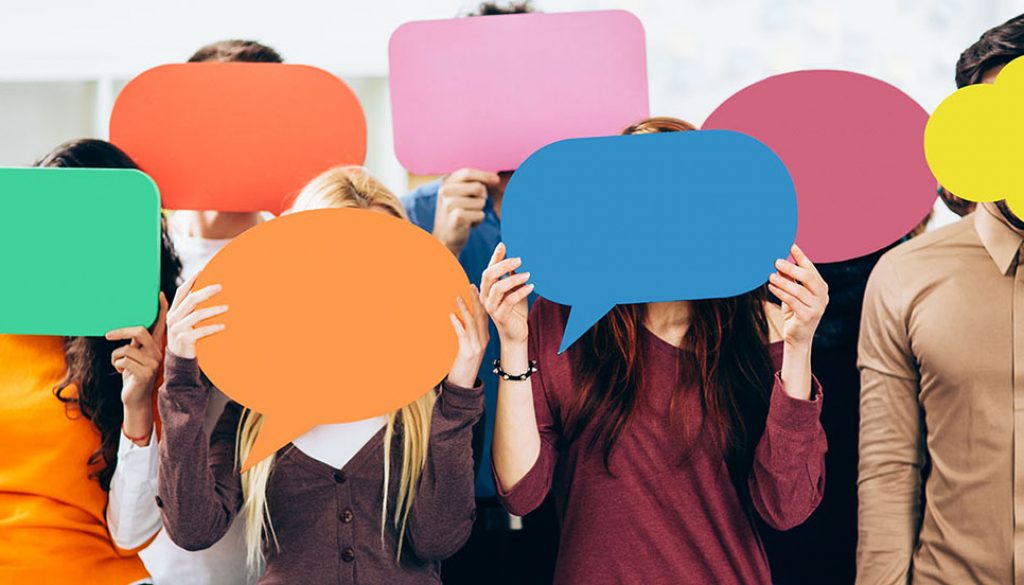 Translation terms are mysterious! A group of young people holding blank speech bubbles.