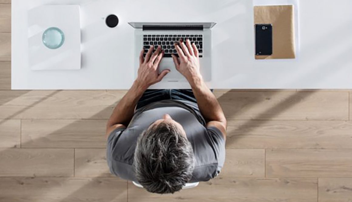 Integrated DTP and translation: calm worker, at a clean desk.