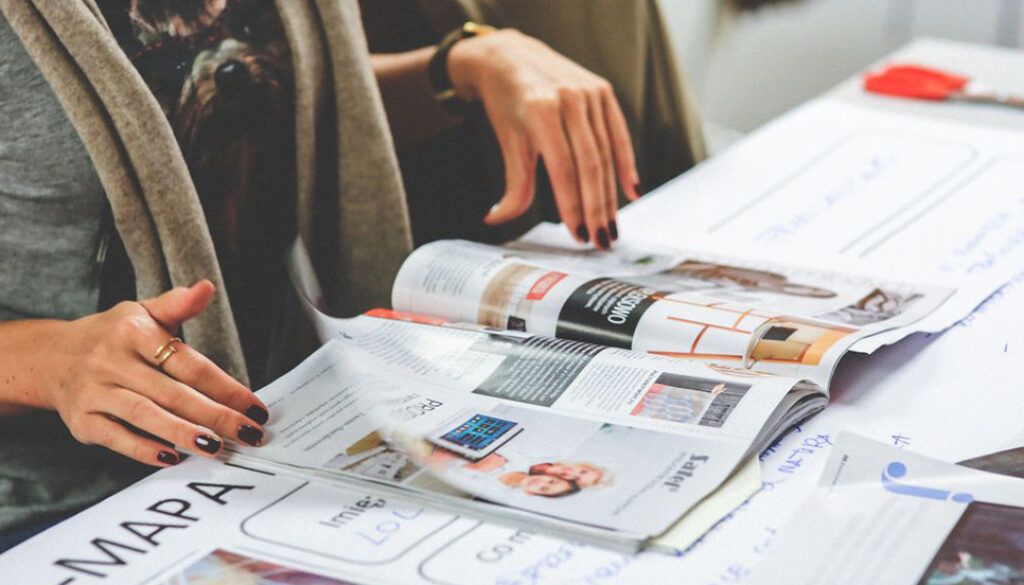 woman browsing through a magazine, multilingual content
