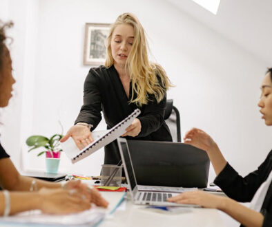 Office workers in a meeting, hopefully using plain English or Business English