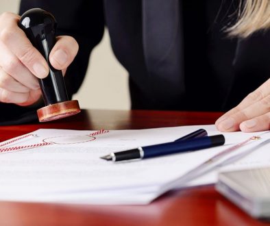 Sworn translator stamping a sworn translation.